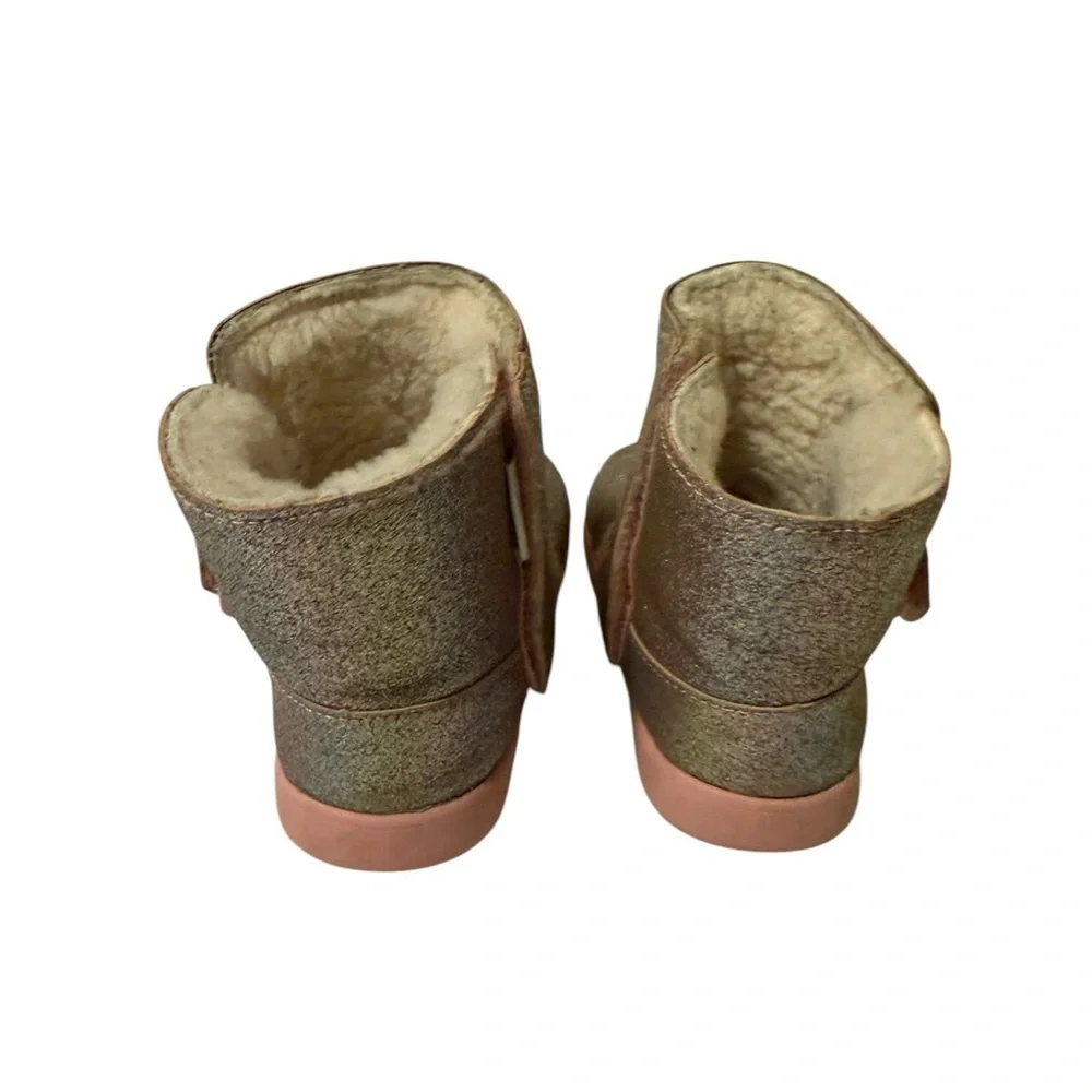 UGG’s Sparkly Gold and Pink Boots.